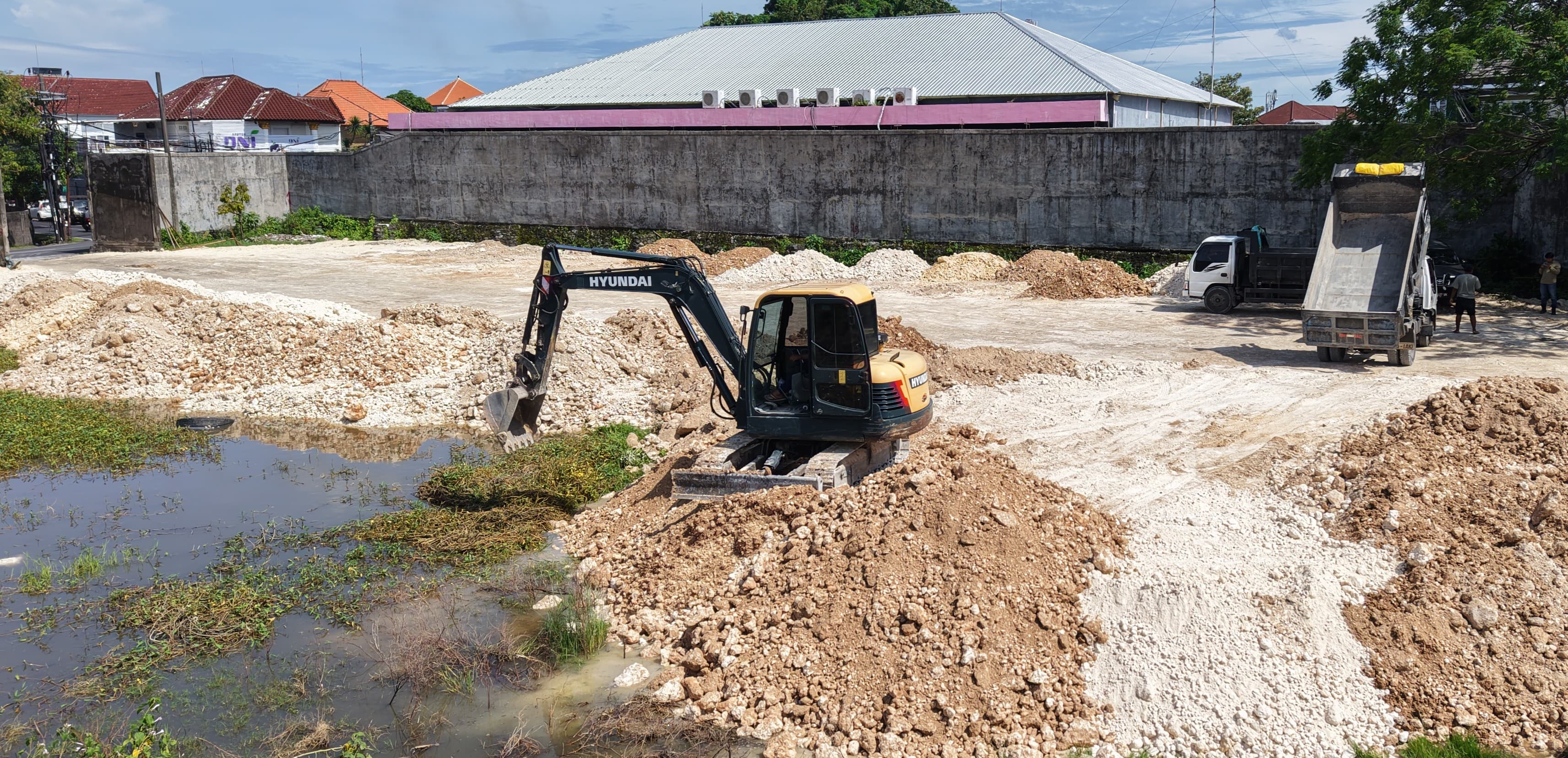 Heavy equipment and limestone materials at a Bali Limestone construction site